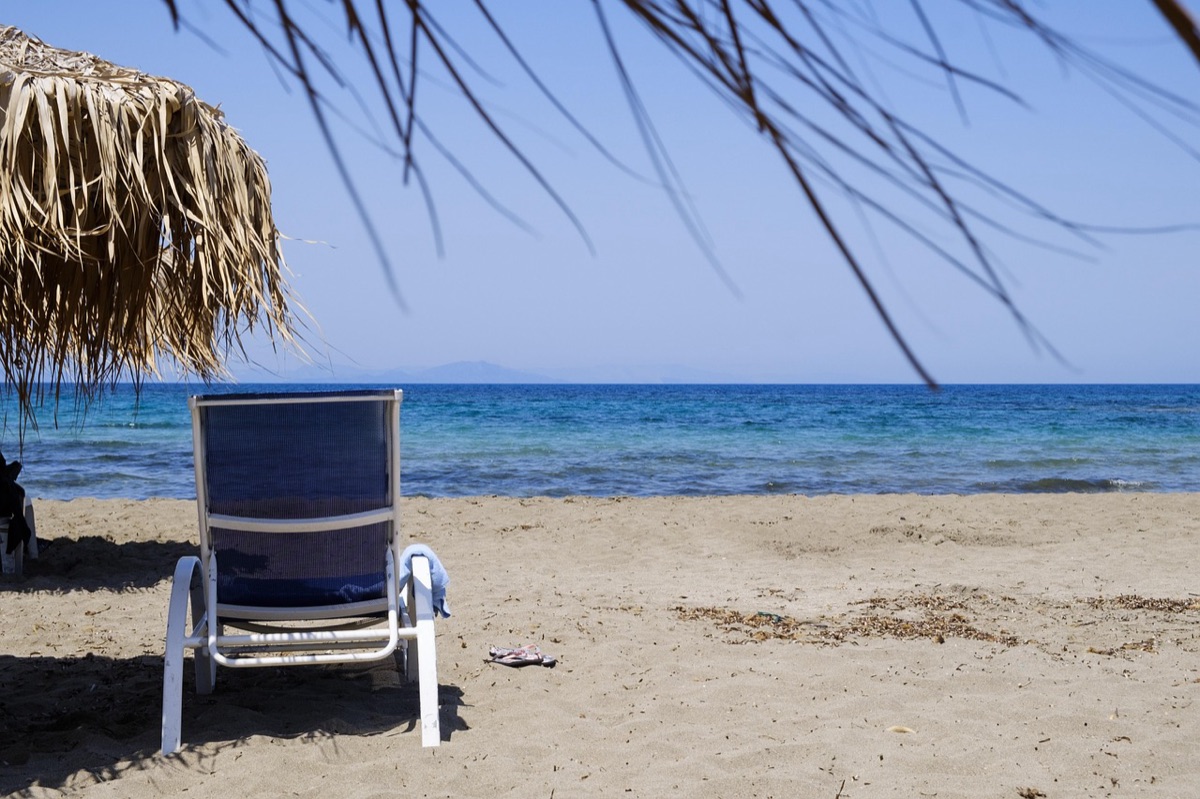 Hawaiian Beach with Umbrella and Lounge Chair