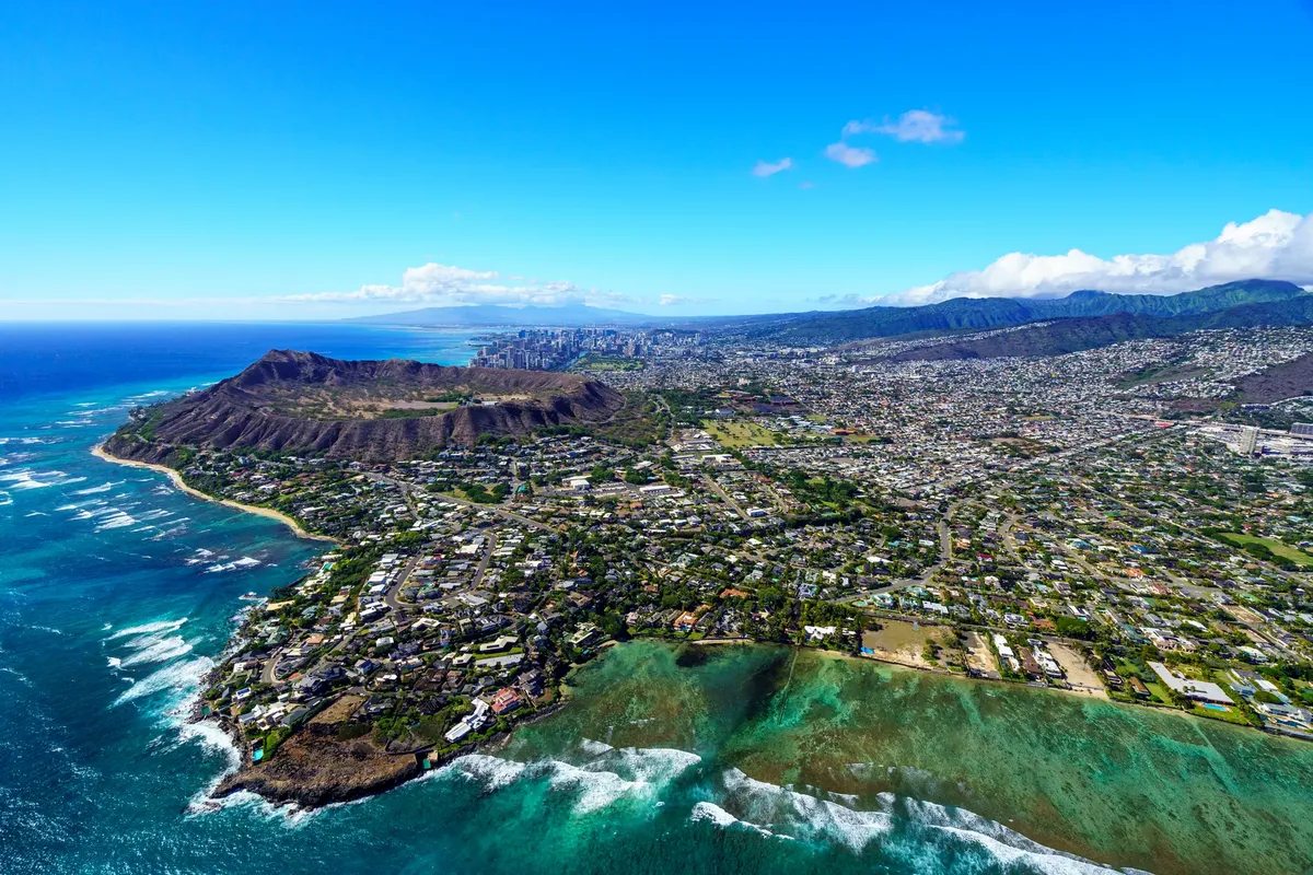Stunning aerial view of Honolulu with Diamond Head Crater and Pacific Ocean. Perfect for travel inspiration.